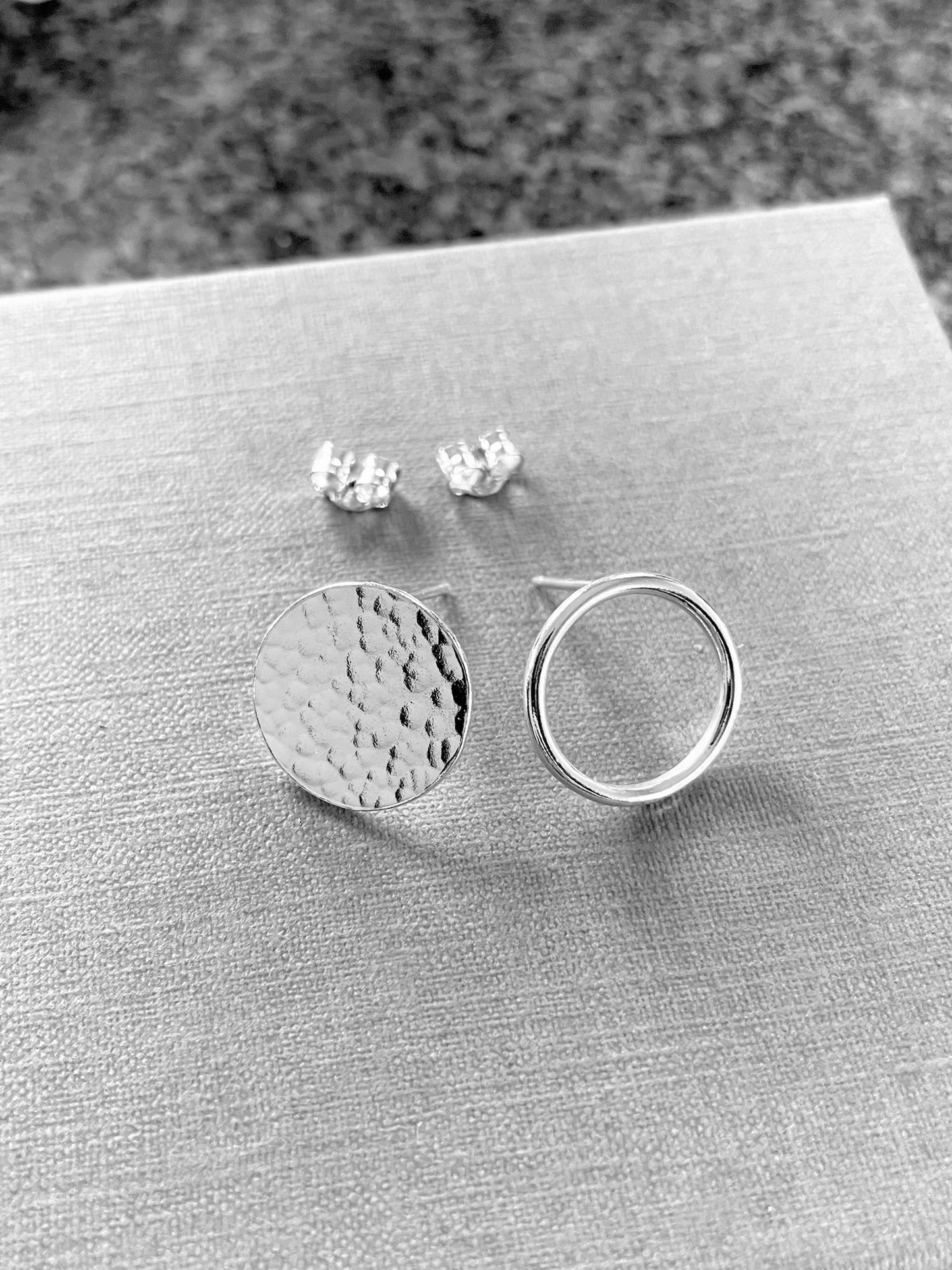Mismatched circle stud earrings in sterling silver
