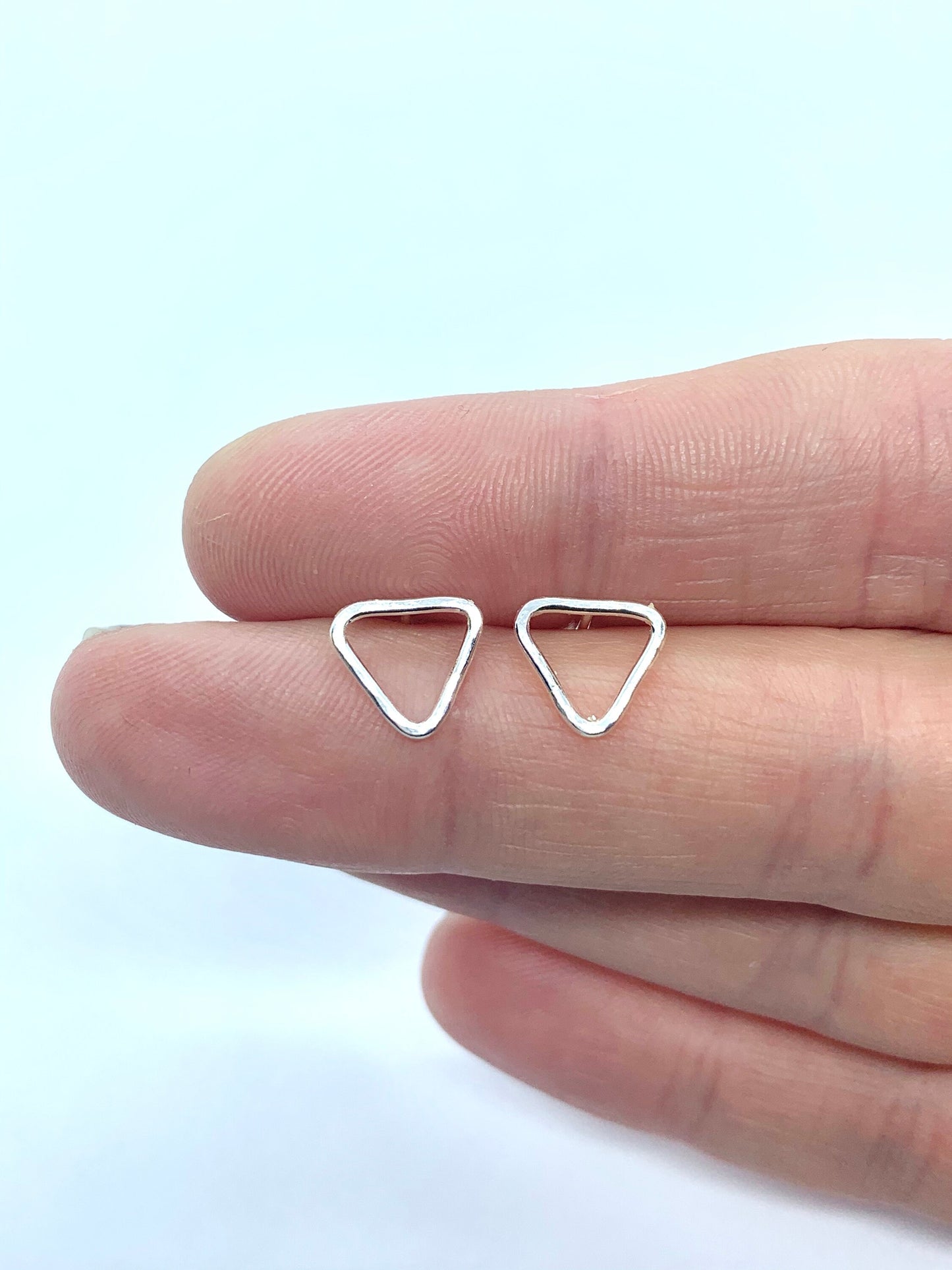 Small silver triangle stud earrings