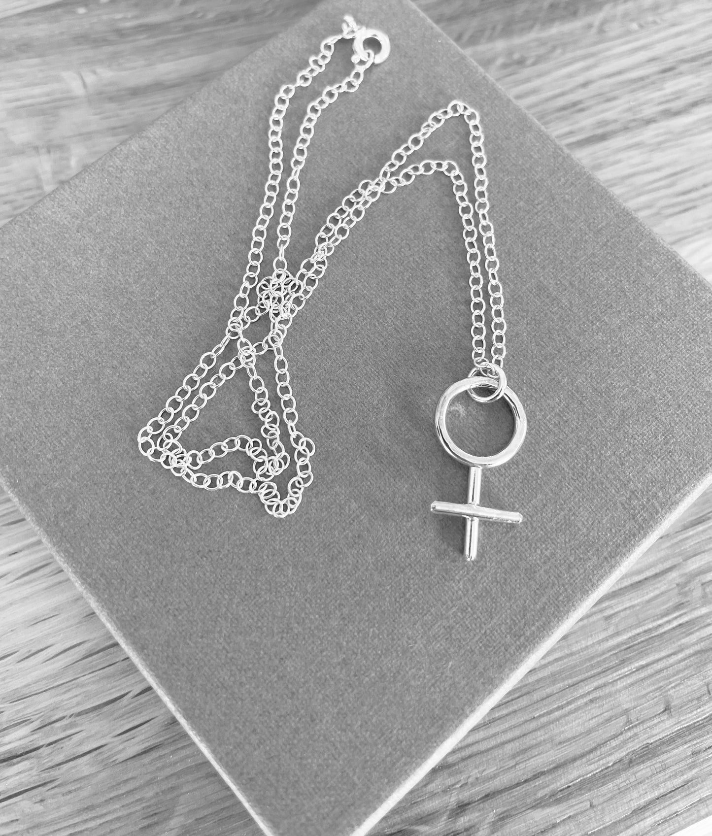 Female symbol necklace