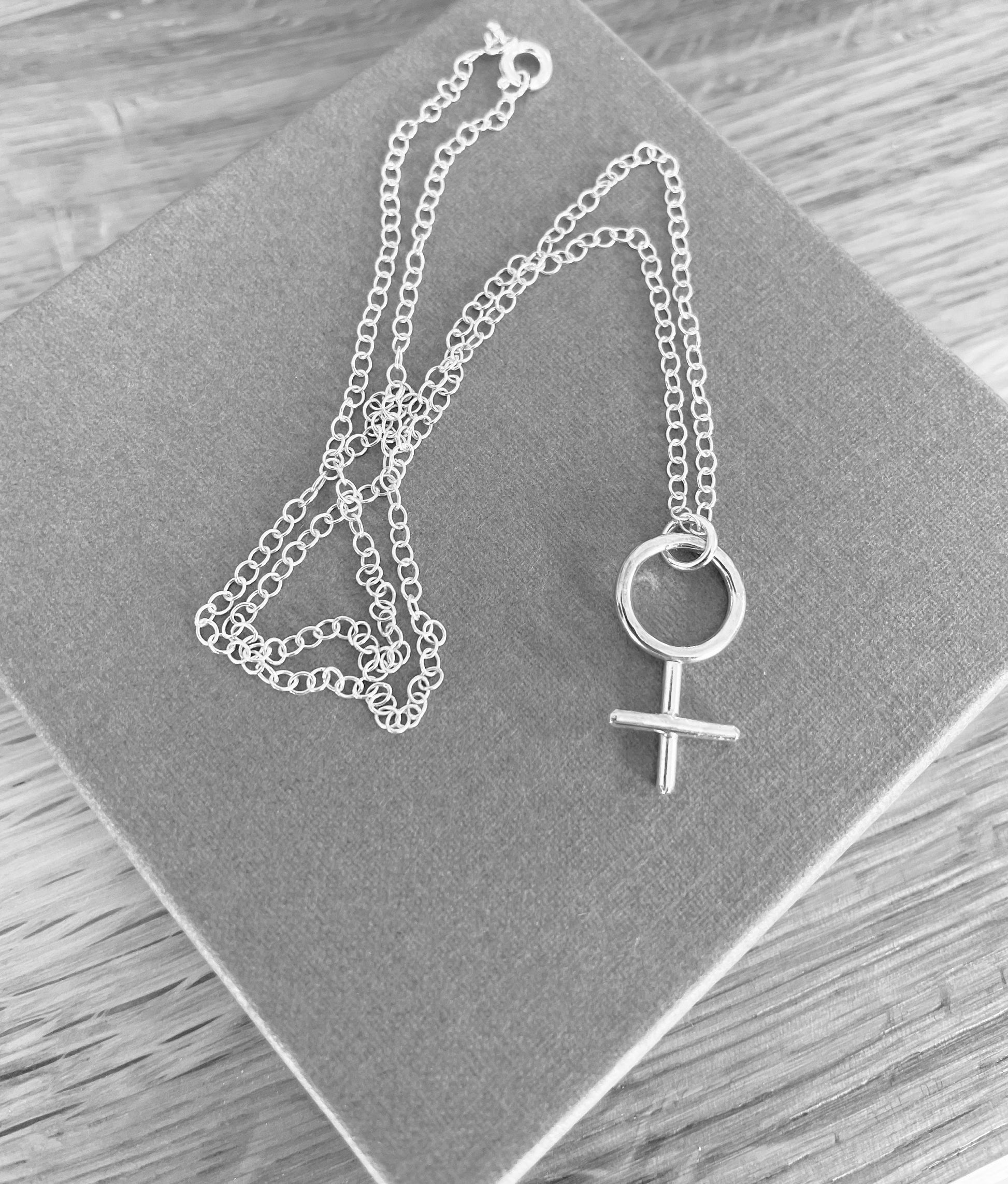 Female symbol necklace