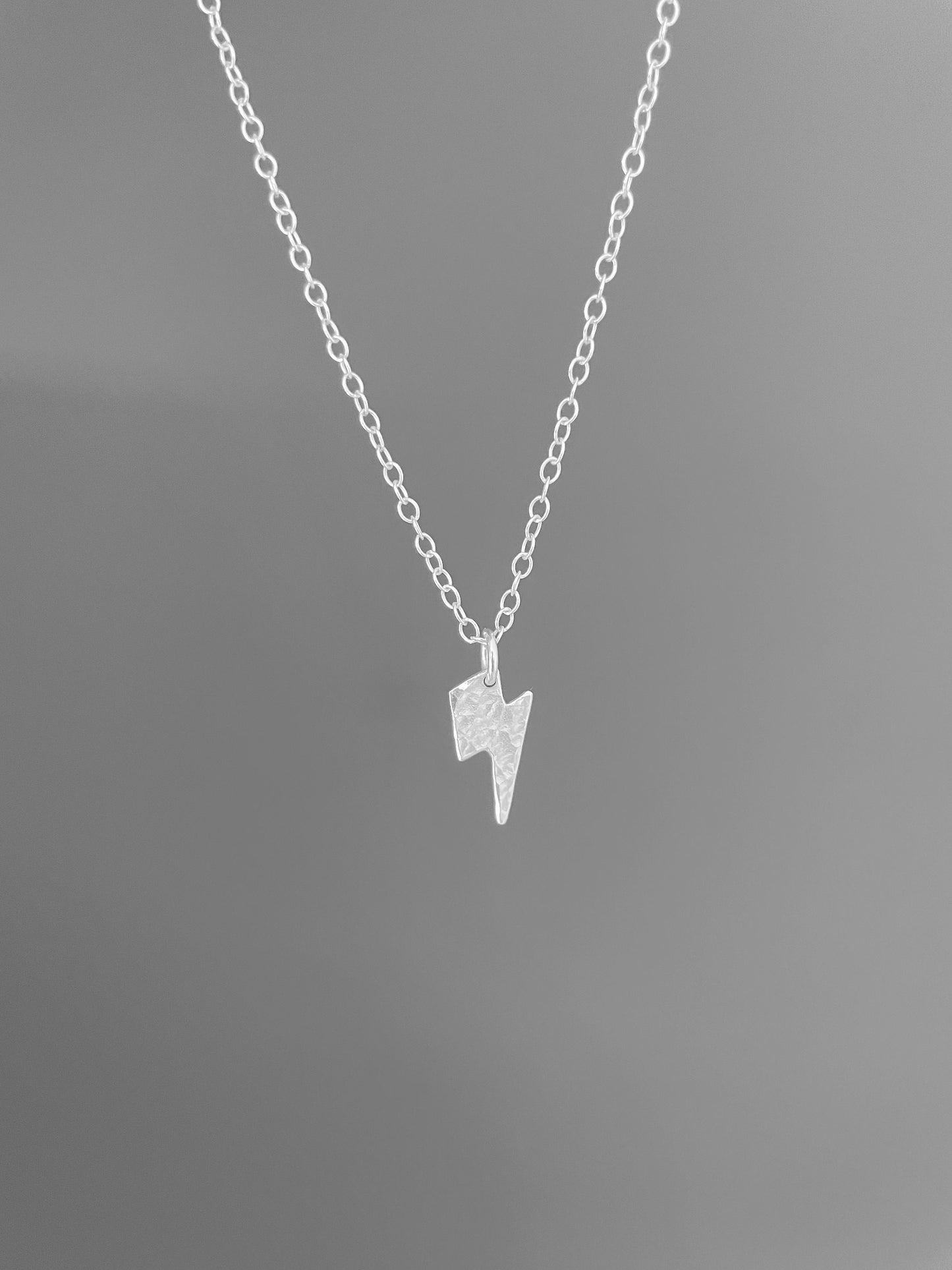 Small silver lightning bolt necklace